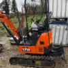 5-26-1.webp Mini-Pelle Hitachi 17U – 2023 – Seulement 223 h – Comme Neuve